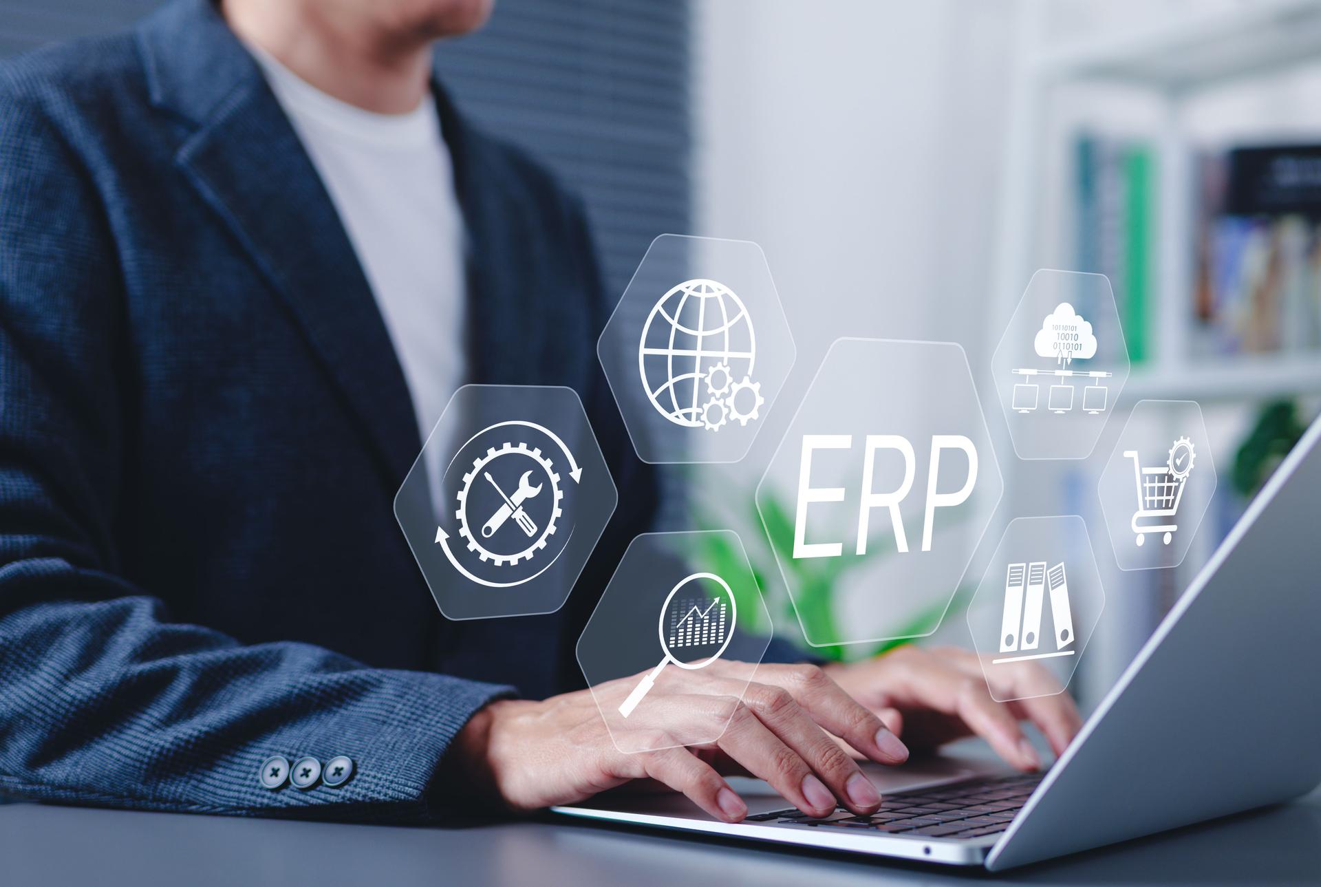 ERP Enterprise Resource Planning system concept. Businessman using laptop with digital interface ERP (Enterprise Resource Planning) icons, business automation, data integration, workflow management,